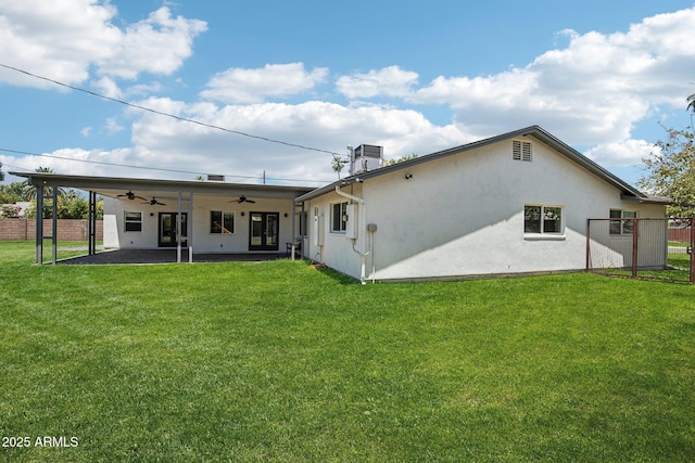 615 E Winter Dr, Phoenix, AZ 85020 - back of house with a ceiling fan, a patio area, and stucco siding