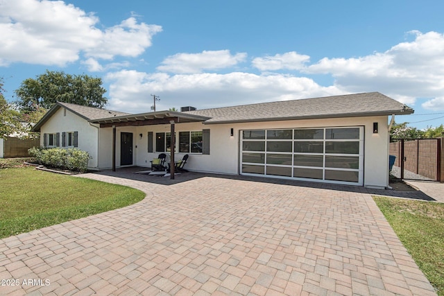 615 E Winter Dr, Phoenix, AZ 85020 - ranch-style house with decorative driveway, stucco siding, a patio, and an attached garage
