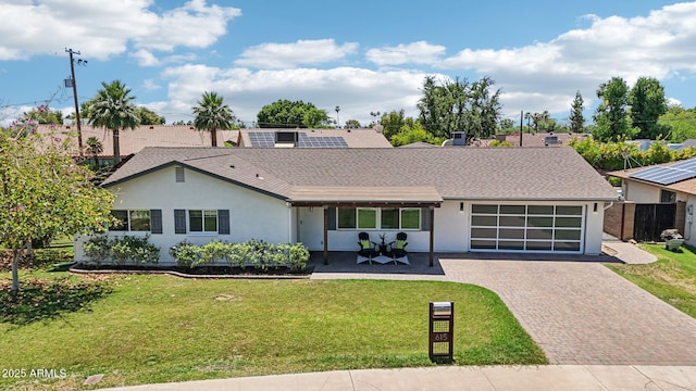 615 E Winter Dr, Phoenix, AZ 85020 - view of front of property featuring decorative driveway, stucco siding, a front lawn, and a shingled roof