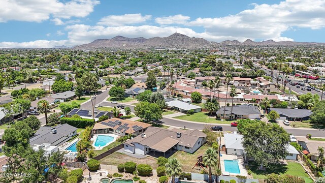 615 E Winter Dr, Phoenix, AZ 85020 - aerial perspective of suburban area with a pool area and a mountainous background