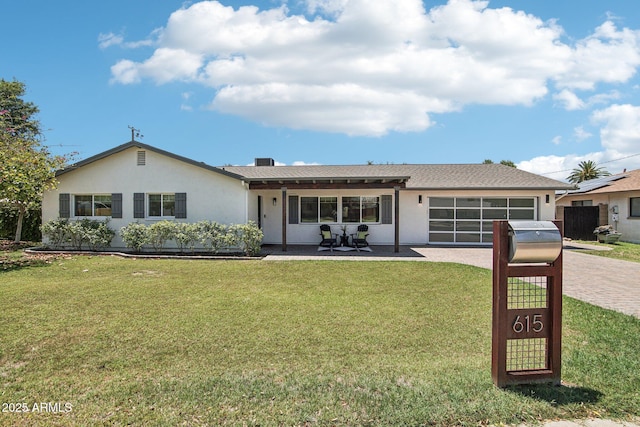 615 E Winter Dr, Phoenix, AZ 85020 - ranch-style house featuring driveway, a front lawn, an attached garage, and stucco siding