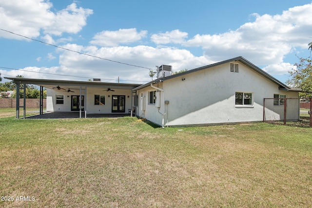 615 E Winter Dr, Phoenix, AZ 85020 - back of house with a ceiling fan, stucco siding, and a patio area