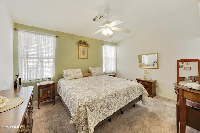 bedroom with light colored carpet and a ceiling fan