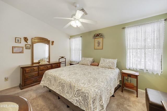 bedroom with light carpet, a ceiling fan, and baseboards