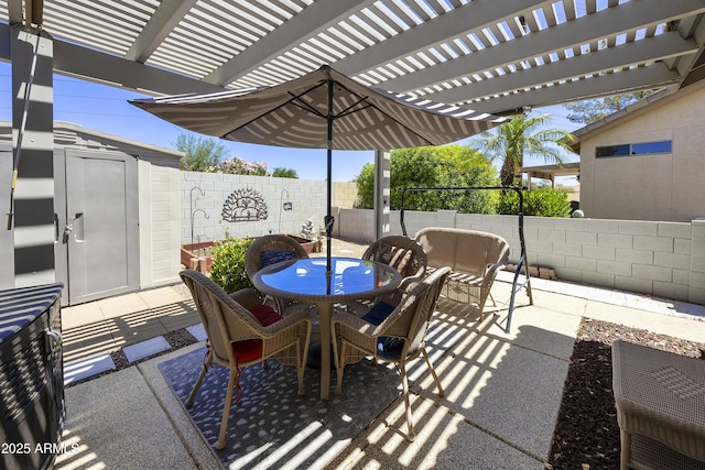 view of patio / terrace with a fenced backyard, outdoor dining area, and a pergola