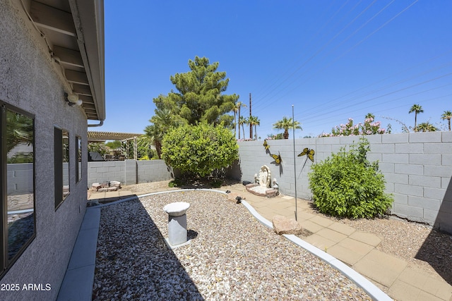 fenced backyard featuring a patio