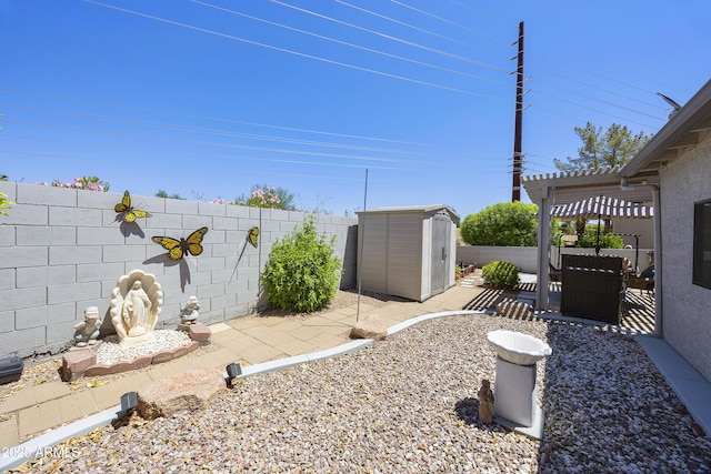 fenced backyard with a storage shed, an outbuilding, a patio, and a pergola