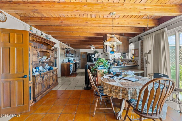 unfurnished dining area featuring wood ceiling, beam ceiling, and light tile patterned floors