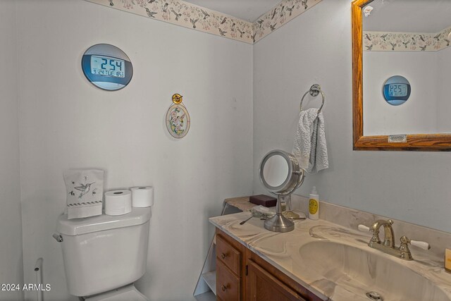 bathroom with vanity and toilet