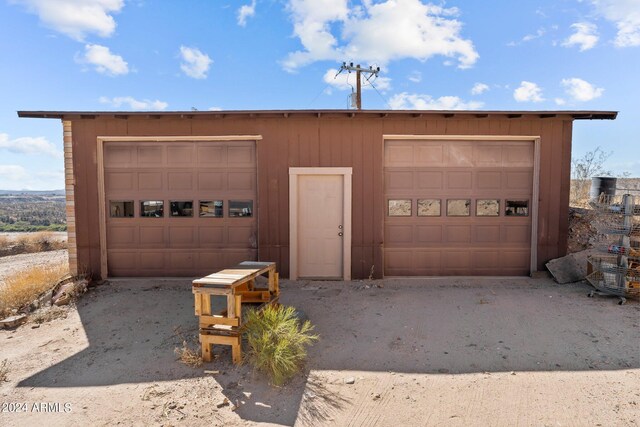 garage with wood walls