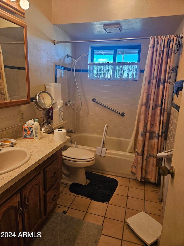 full bathroom featuring toilet, shower / bath combo, vanity, and tile patterned floors