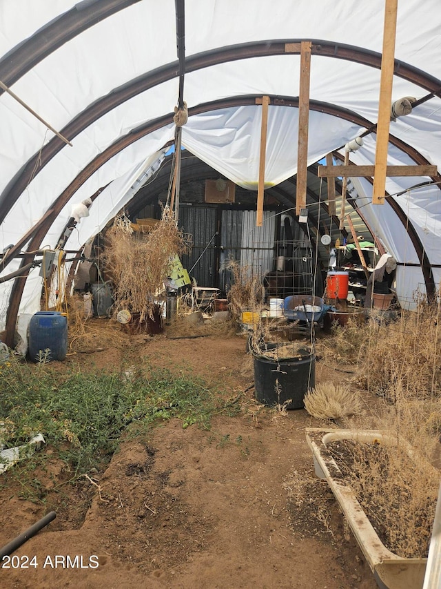 exterior space with vaulted ceiling