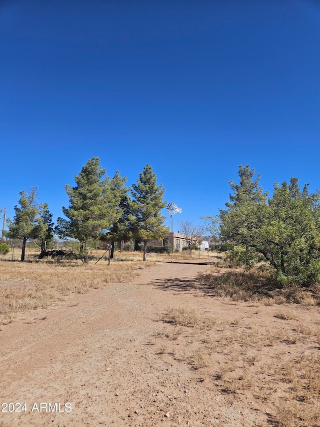 view of yard with a rural view