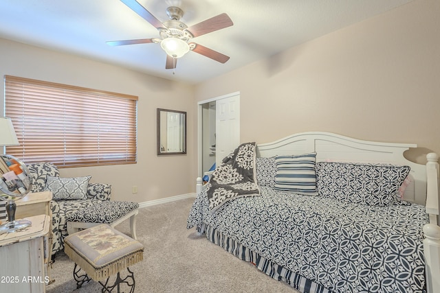 bedroom with ceiling fan, carpet flooring, and baseboards