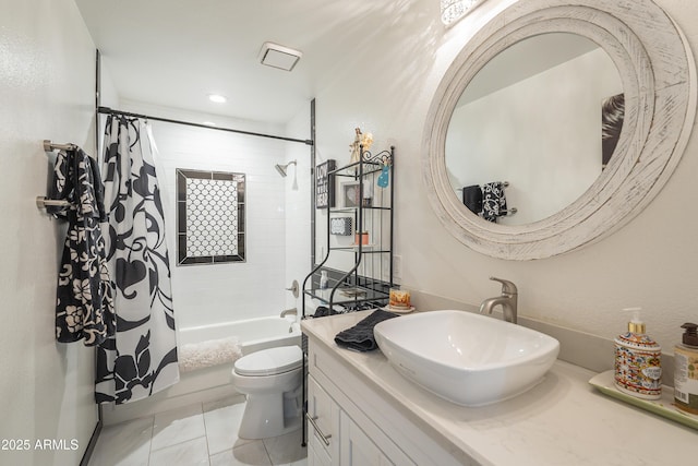 bathroom featuring toilet, shower / bath combo, vanity, and tile patterned floors