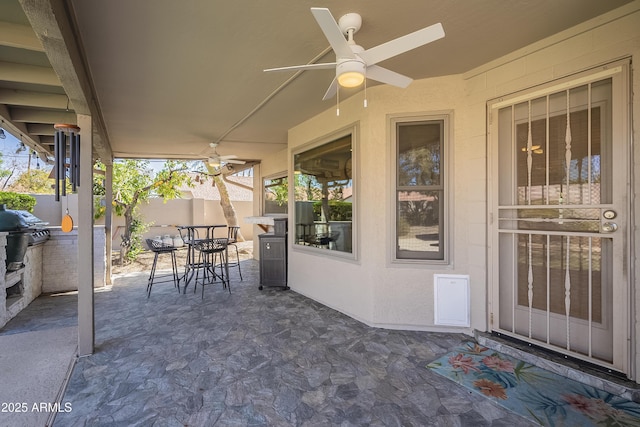 view of patio / terrace with a ceiling fan, outdoor dining area, fence, and area for grilling