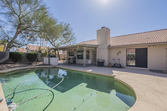 view of pool featuring a patio, fence, and a fenced in pool