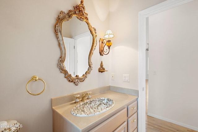 bathroom with wood-type flooring and vanity