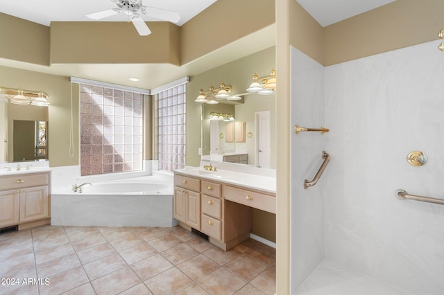 bathroom with a bathtub, tile patterned flooring, vanity, and ceiling fan