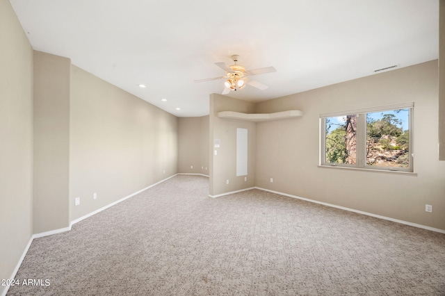 carpeted empty room with ceiling fan