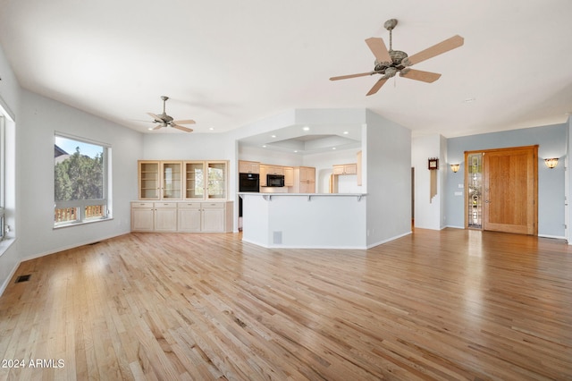 unfurnished living room with light hardwood / wood-style flooring and ceiling fan