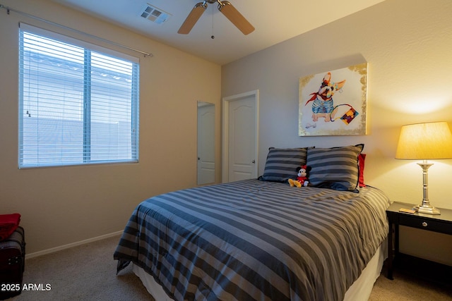 bedroom featuring visible vents, baseboards, carpet flooring, and ceiling fan