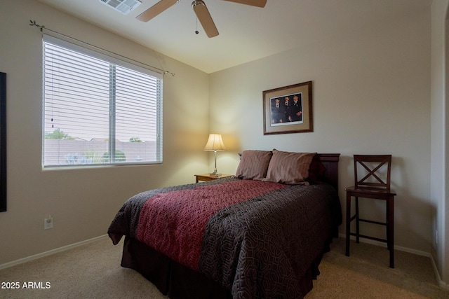 bedroom with baseboards, a ceiling fan, visible vents, and carpet floors