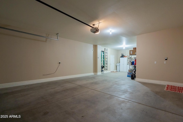 garage featuring baseboards and a garage door opener
