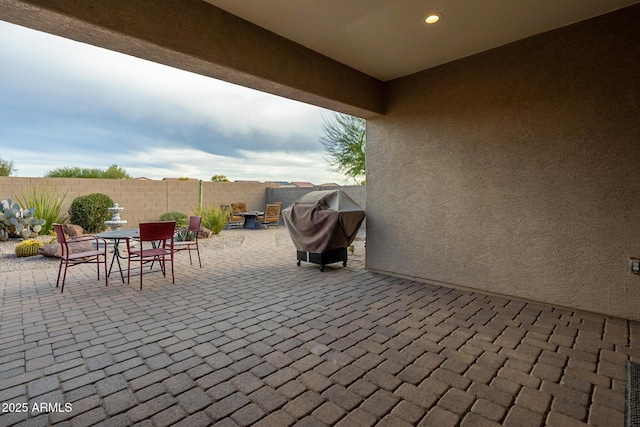 view of patio / terrace featuring a fenced backyard and a grill