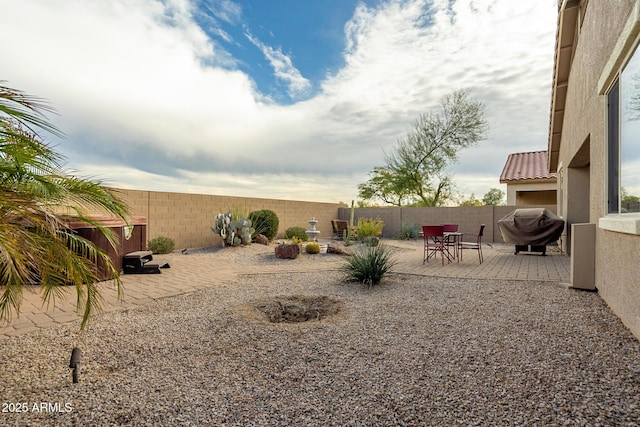 view of yard with a patio area and a fenced backyard