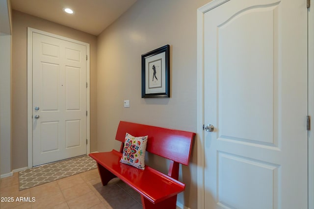 foyer featuring light tile patterned floors and recessed lighting