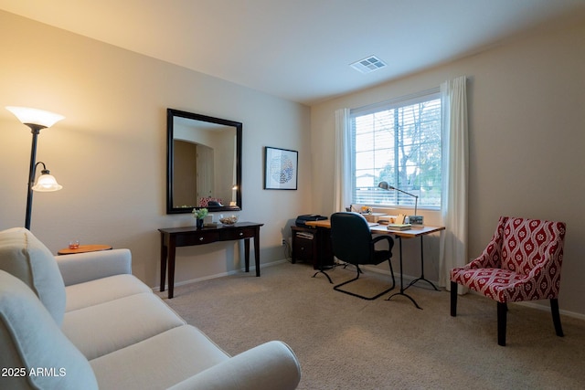 office space featuring visible vents, baseboards, and carpet flooring