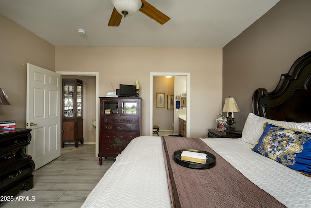 bedroom with ceiling fan and ensuite bath