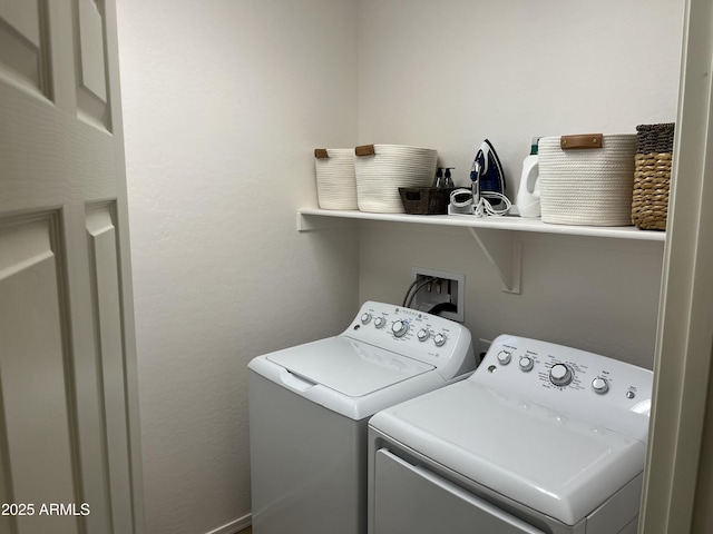 laundry room featuring washer and clothes dryer