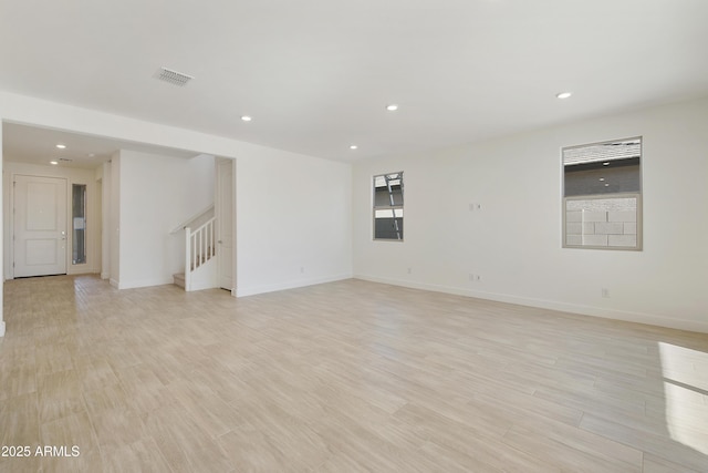 unfurnished room featuring light wood-type flooring