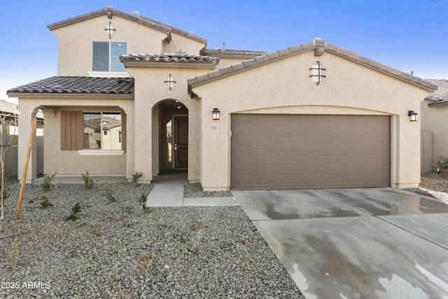 mediterranean / spanish-style home featuring a garage