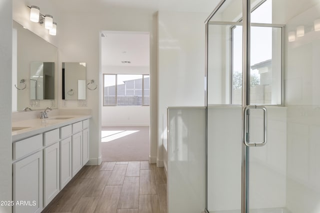 bathroom with vanity and an enclosed shower