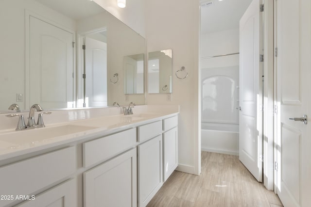 bathroom featuring vanity and hardwood / wood-style flooring