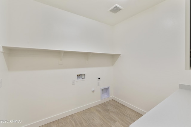 laundry area with electric dryer hookup, hookup for a gas dryer, washer hookup, and light hardwood / wood-style floors