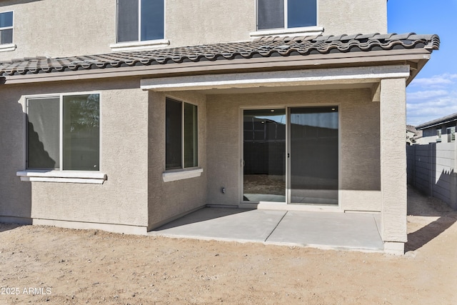 rear view of property featuring a patio