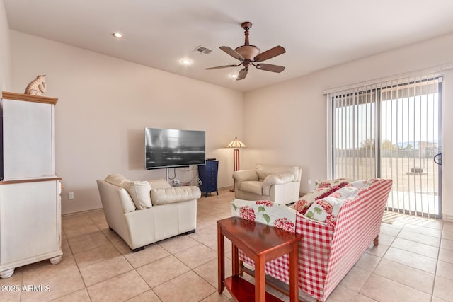 living room featuring ceiling fan and light tile patterned flooring