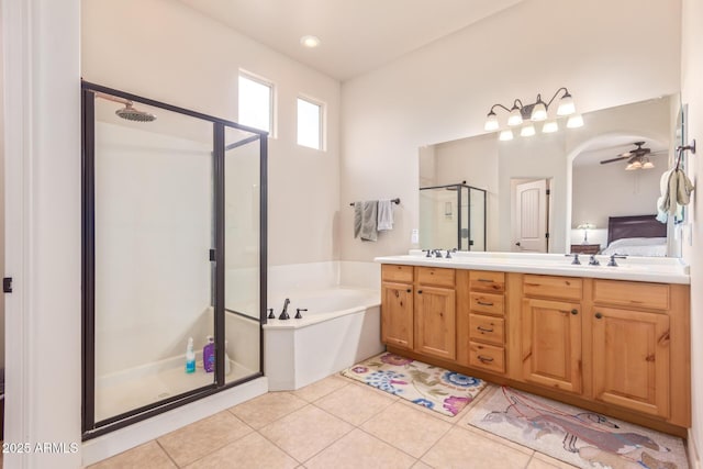 bathroom featuring tile patterned flooring, ceiling fan, vanity, and independent shower and bath