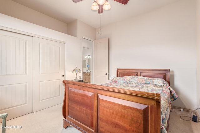 carpeted bedroom with a closet and ceiling fan