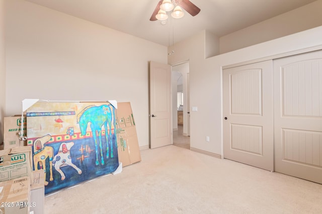 playroom featuring light colored carpet and ceiling fan