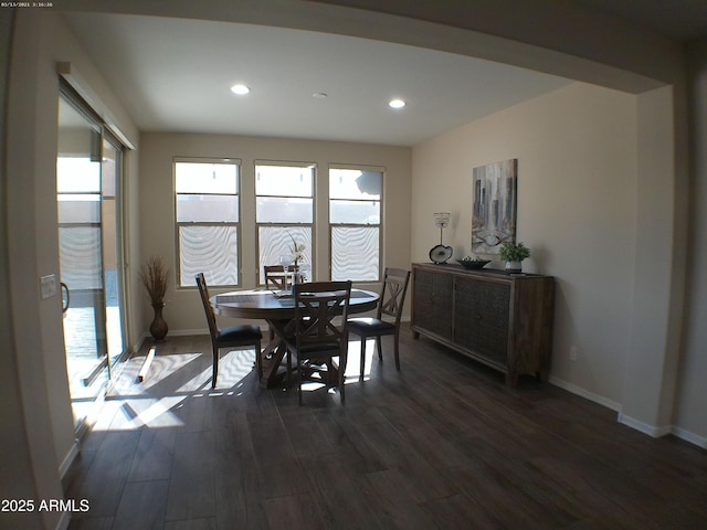 dining area featuring dark hardwood / wood-style floors