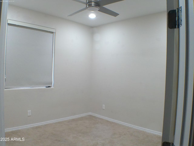 unfurnished room featuring ceiling fan and light colored carpet