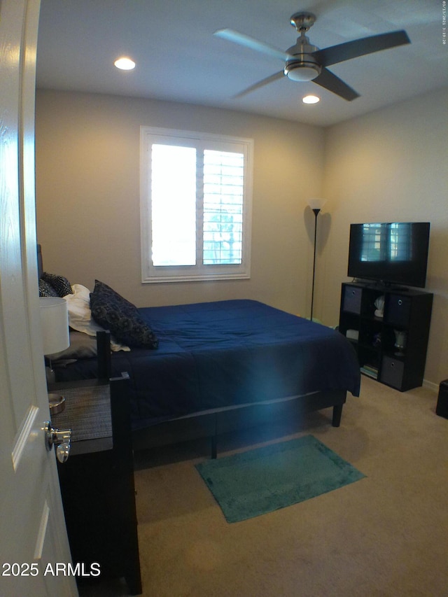 carpeted bedroom with ceiling fan