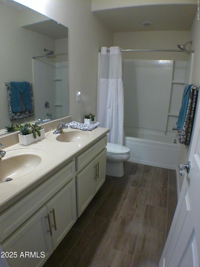 full bathroom with shower / bathtub combination with curtain, vanity, and toilet