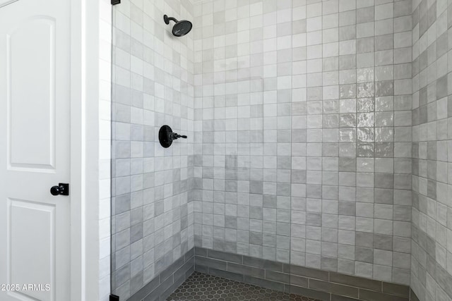 bathroom with tiled shower