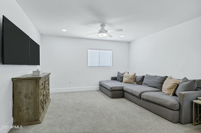 living room featuring baseboards, recessed lighting, a ceiling fan, and light colored carpet